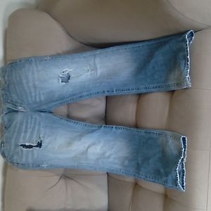Pair of Affliction jeans ripped style